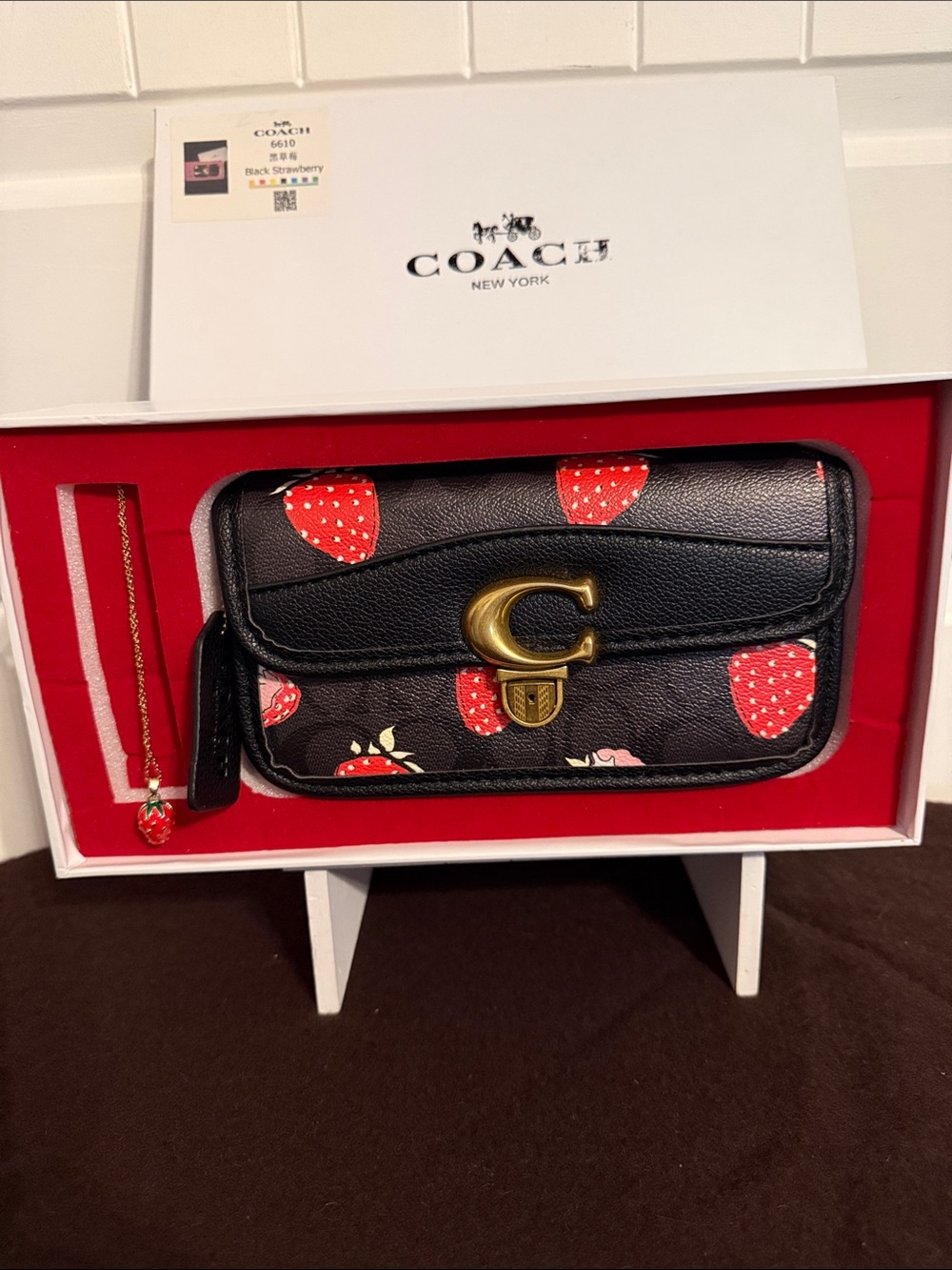 Coach Black Wallet with Red Strawberry Motif and Gold 'C' Hardware